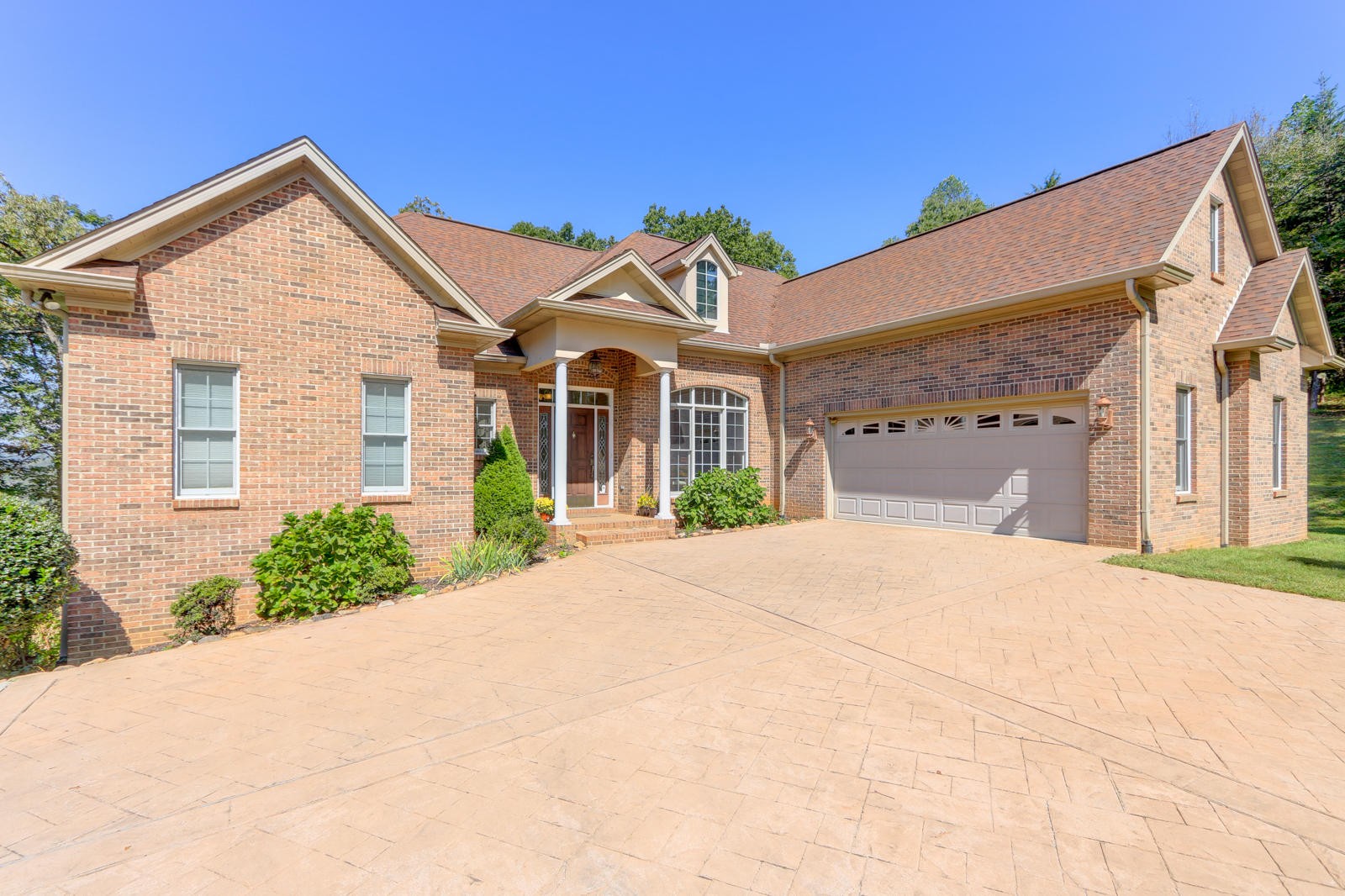 2300 Matlock Bend Road Loudon, TN 37774 - Photo 5 of 39 a front view of a house with a yard and garage