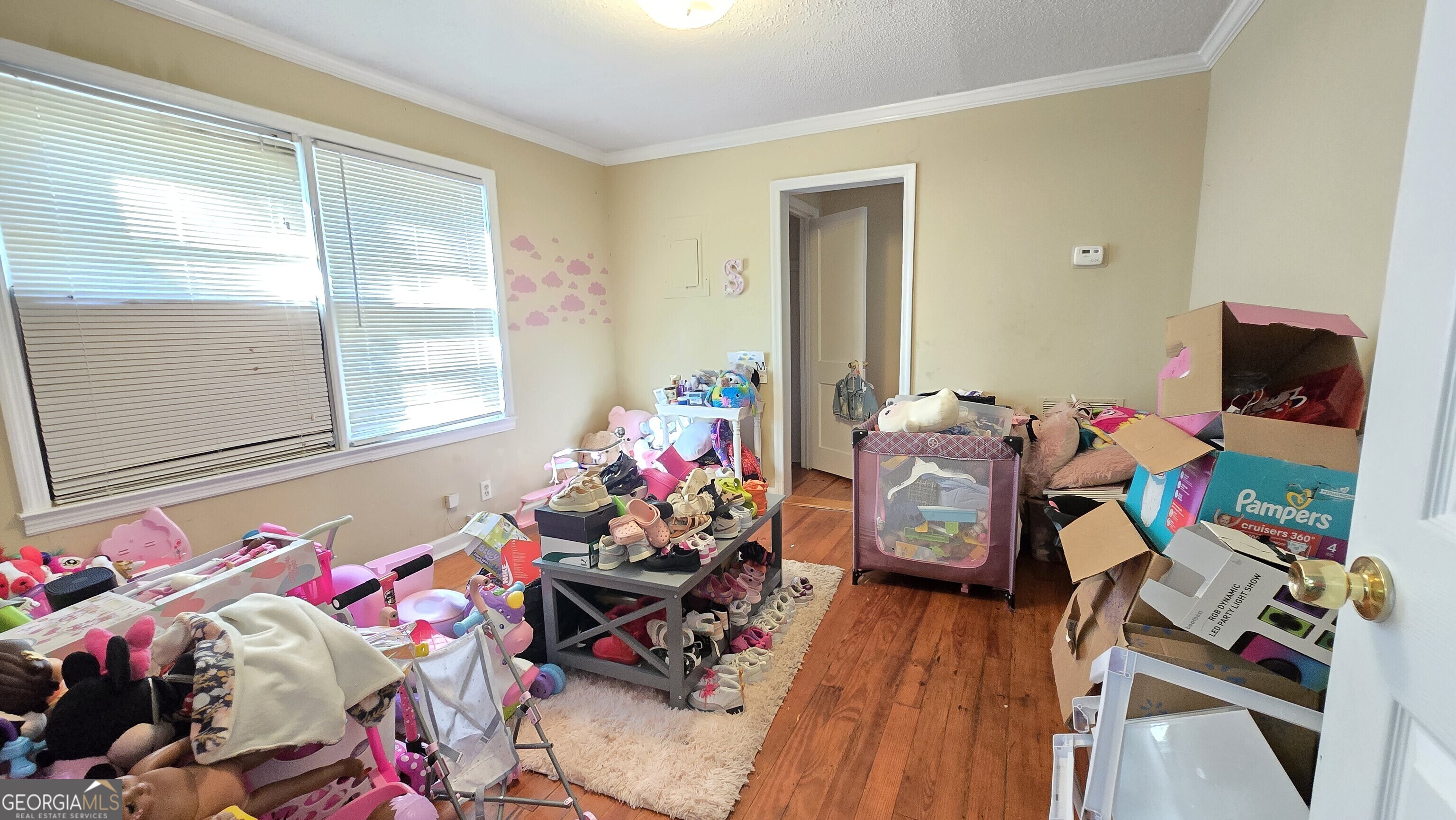 377 Dock Hyde Road Carrollton, GA 30116 - Photo 13 of 31 a living room filled with furniture and a wooden floor