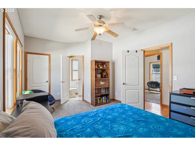 a living room with closet and furniture