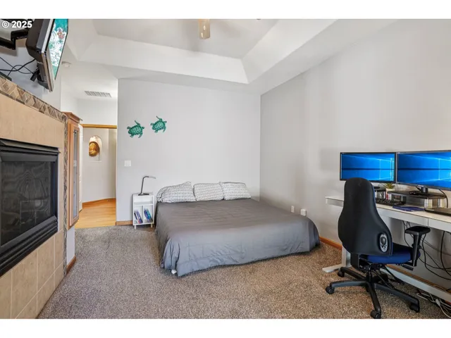 a bedroom with a bed and a desk