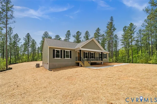 a view of house with backyard