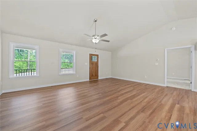 a view of a kitchen cabinets a sink and wooden floor