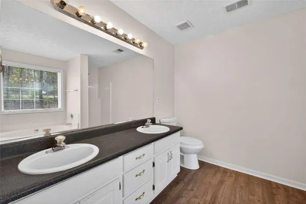 a bathroom with a bath tub and shower