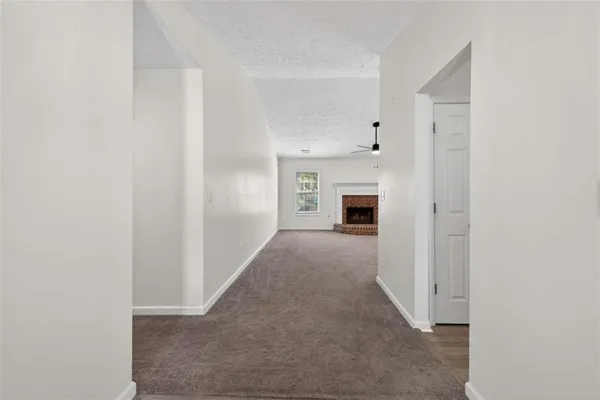 wooden floor in an empty room with a fireplace