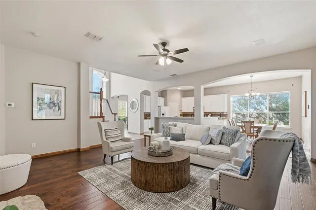 a living room with furniture and a large window