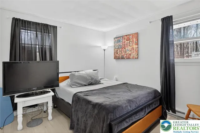 a bedroom with a bed and a cabinets