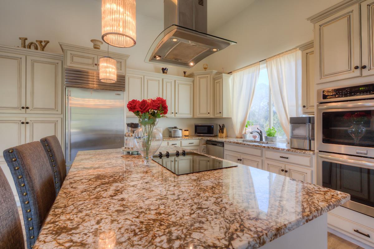 83 Northfork Road Berry Creek, CA 95916 - Photo 28 of 56 a kitchen with stainless steel appliances granite countertop a sink a stove and cabinets