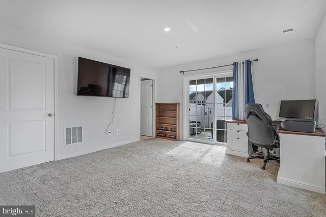 a picture of a bench in front of a wall