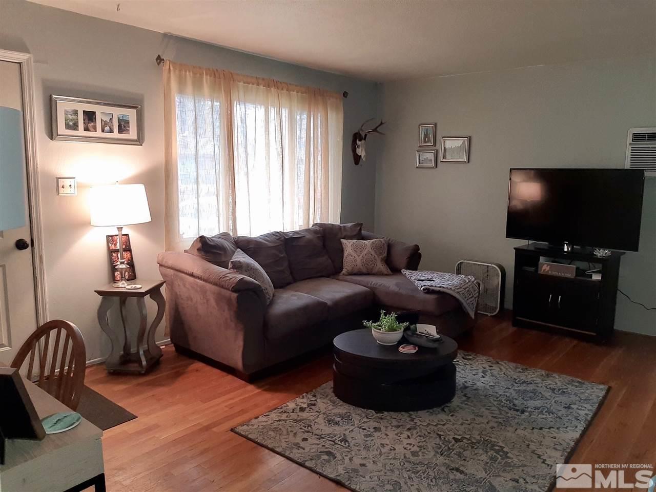 1225 Manhattan Street Reno, NV 89512 - Photo 3 of 19 a living room with furniture and a flat screen tv