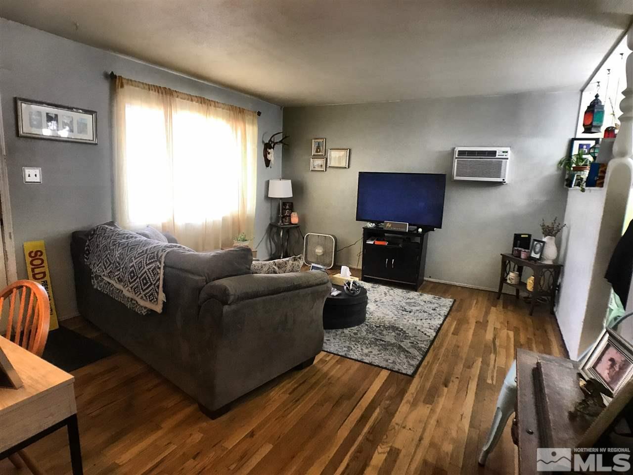 1225 Manhattan Street Reno, NV 89512 - Photo 5 of 19 a living room with furniture and a flat screen tv