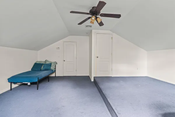 a very nice looking room with a ceiling fan