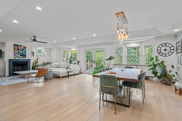 a view of a livingroom with furniture window and wooden floor