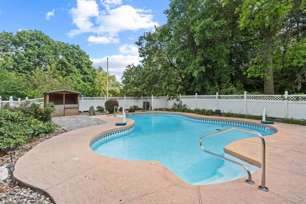a view of a swimming pool with a patio