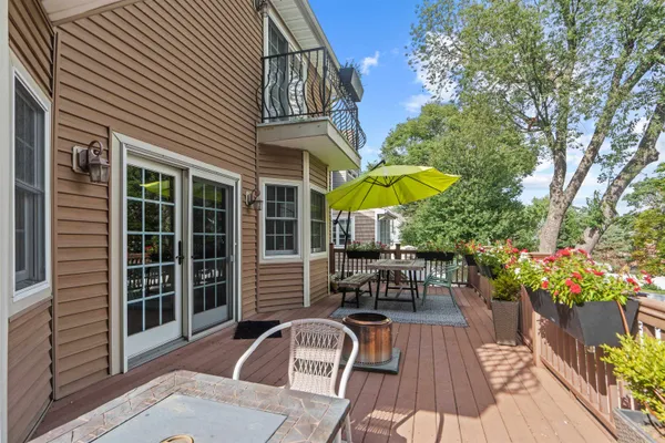 a view of a house with a patio and a yard