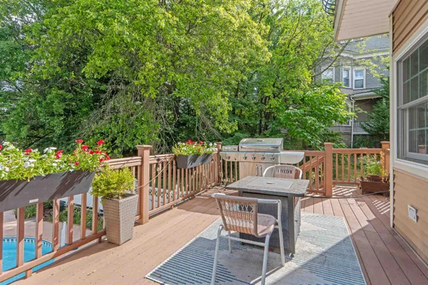 a view of a chairs and table on the wooden deck