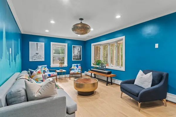 a living room with furniture and a large window