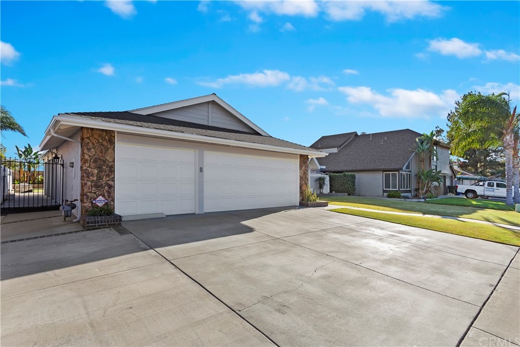 8296 Yearling Way Riverside, CA 92509 - Photo 1 of 1 a front view of a house with a yard and garage