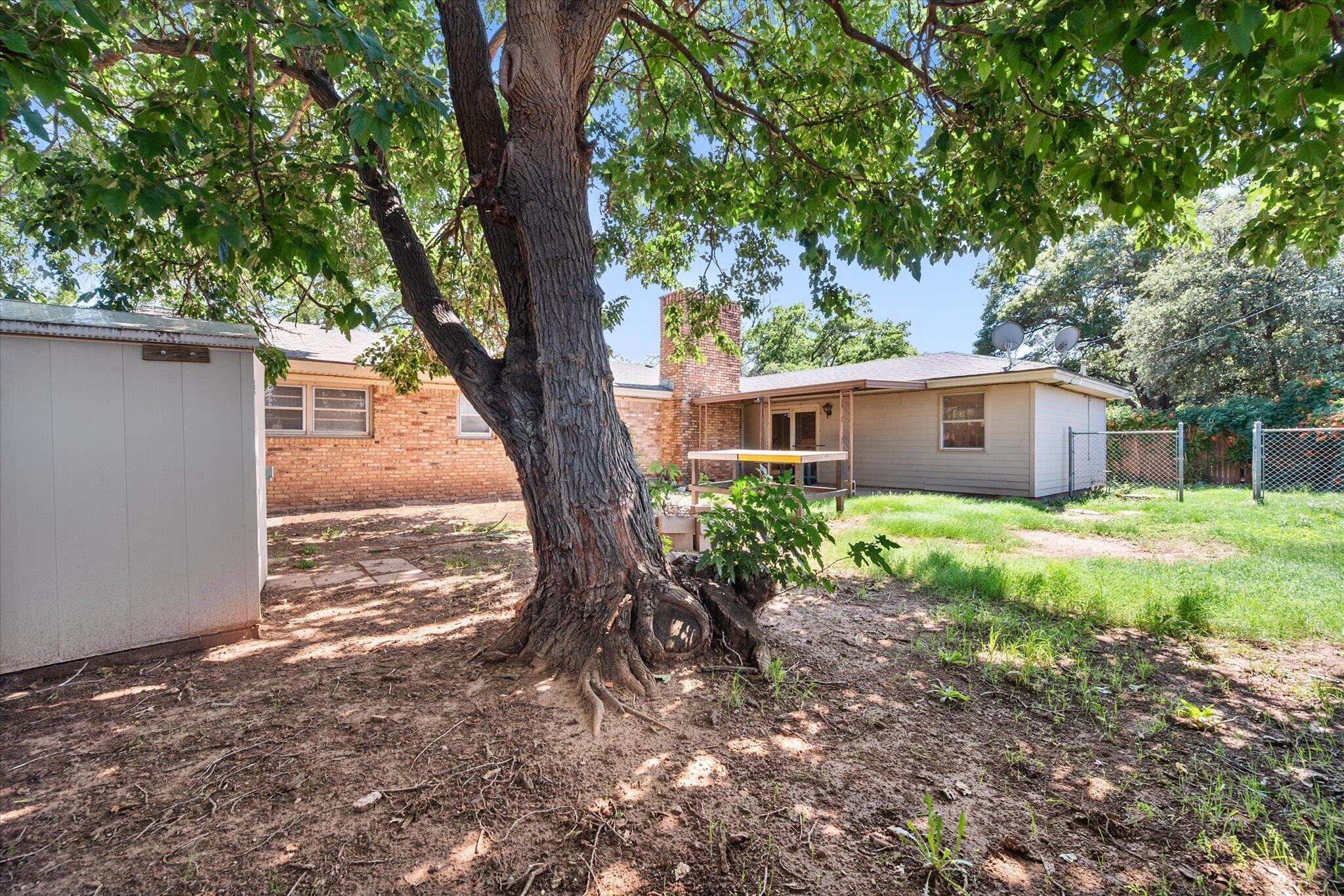 4604 27th Street Lubbock, TX 79410 - Photo 34 of 36 a view of a house with yard and a tree