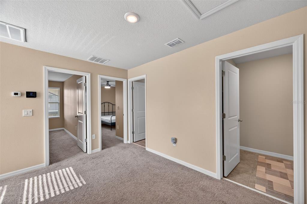 2761 Emory Sound Place Brandon, FL 33510 - Photo 11 of 27 a view of a hallway with wooden shelves