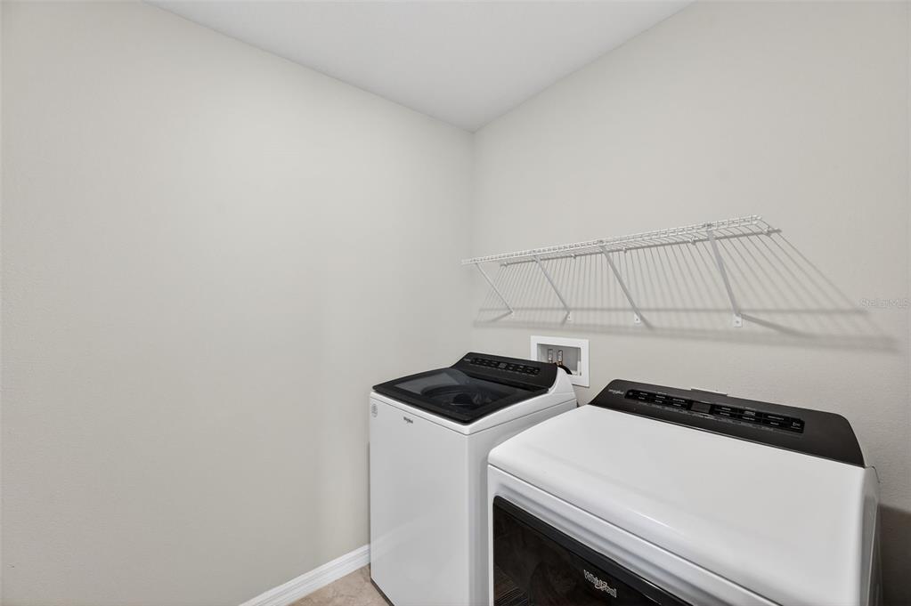 2761 Emory Sound Place Brandon, FL 33510 - Photo 12 of 27 a utility room with dryer and washer