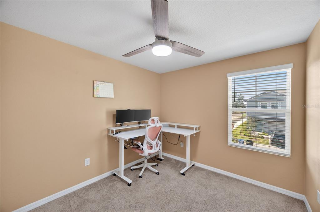 2761 Emory Sound Place Brandon, FL 33510 - Photo 17 of 27 a view of a workspace with furniture and a window