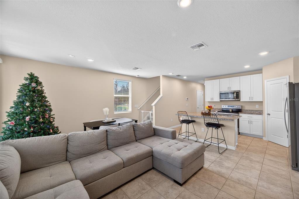2761 Emory Sound Place Brandon, FL 33510 - Photo 7 of 27 a living room with furniture kitchen view and a window