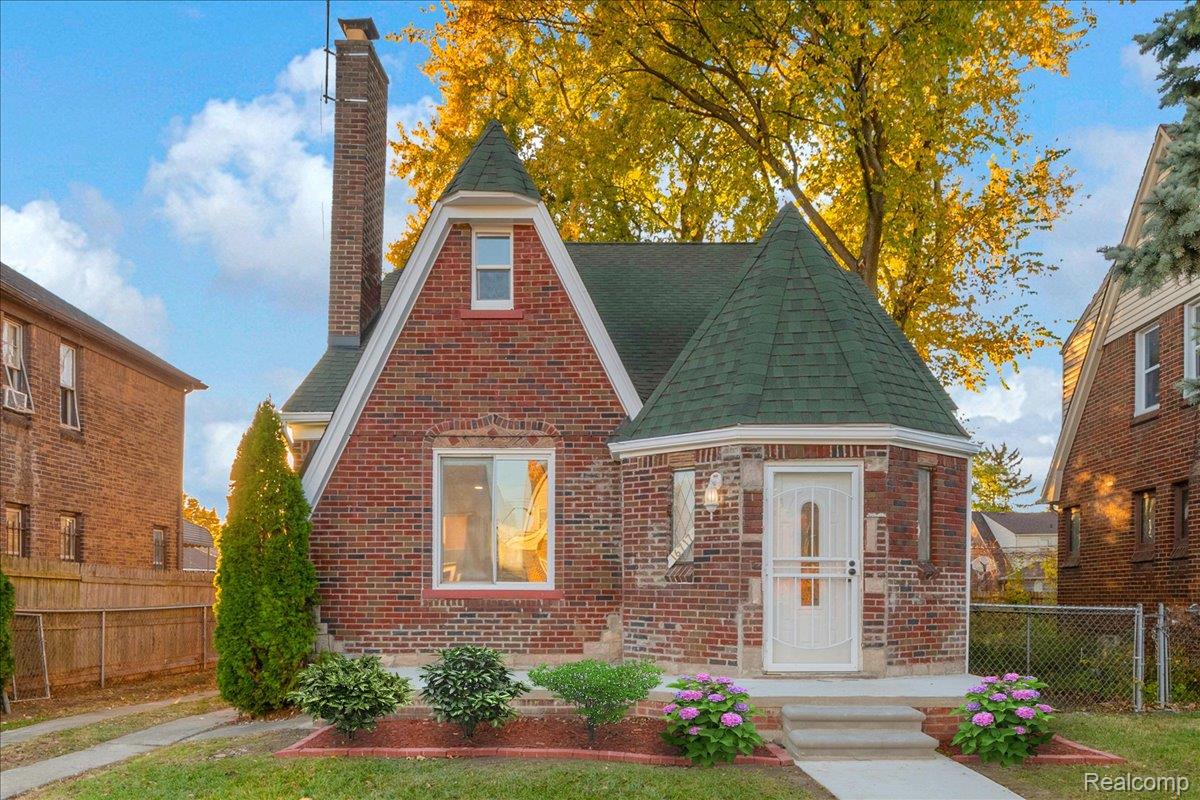 16717 Fielding Street Detroit, MI 48219 - Photo 1 of 46 Tudor house with a shingled roof, a chimney, and brick siding