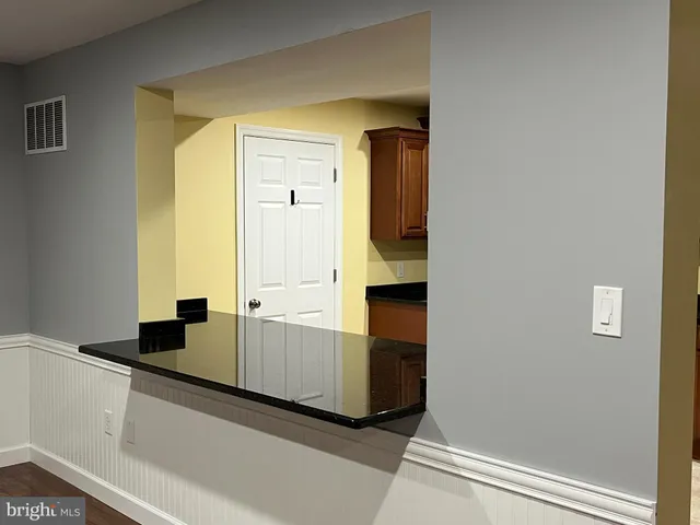 a view of a kitchen from the hallway