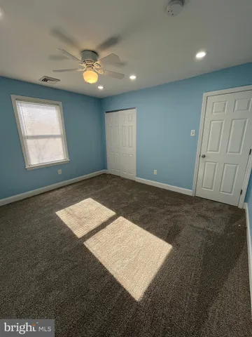 an empty room with wooden floor