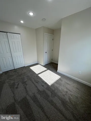 an empty room with wooden floor