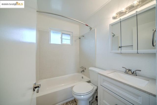 a bathroom with a sink a toilet and a bathtub