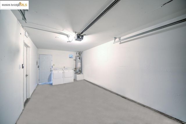 a view of a room with cabinet and a ceiling fan