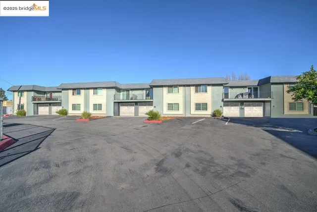 a view of livingroom with a ceiling fan and window