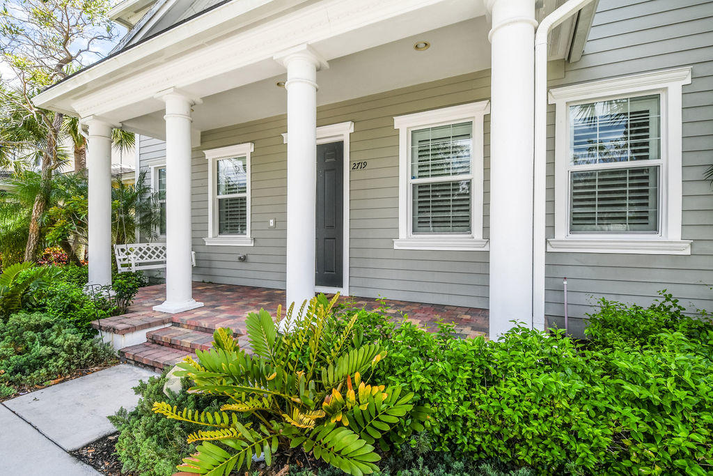 2719 Wymberly Drive Jupiter, FL 33458 - Photo 2 of 49 a view of house with backyard