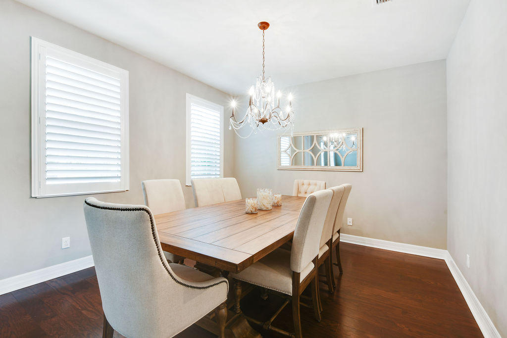 2719 Wymberly Drive Jupiter, FL 33458 - Photo 14 of 49 a view of a dining room with furniture window and wooden floor