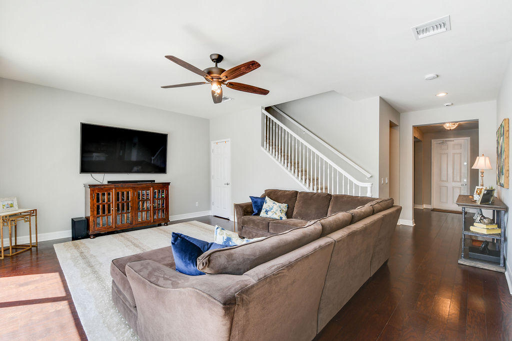 2719 Wymberly Drive Jupiter, FL 33458 - Photo 16 of 49 a living room with furniture and a flat screen tv
