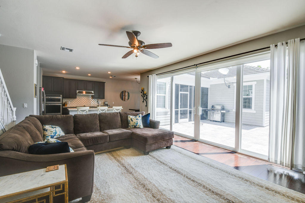 2719 Wymberly Drive Jupiter, FL 33458 - Photo 17 of 49 a living room with furniture and a large window