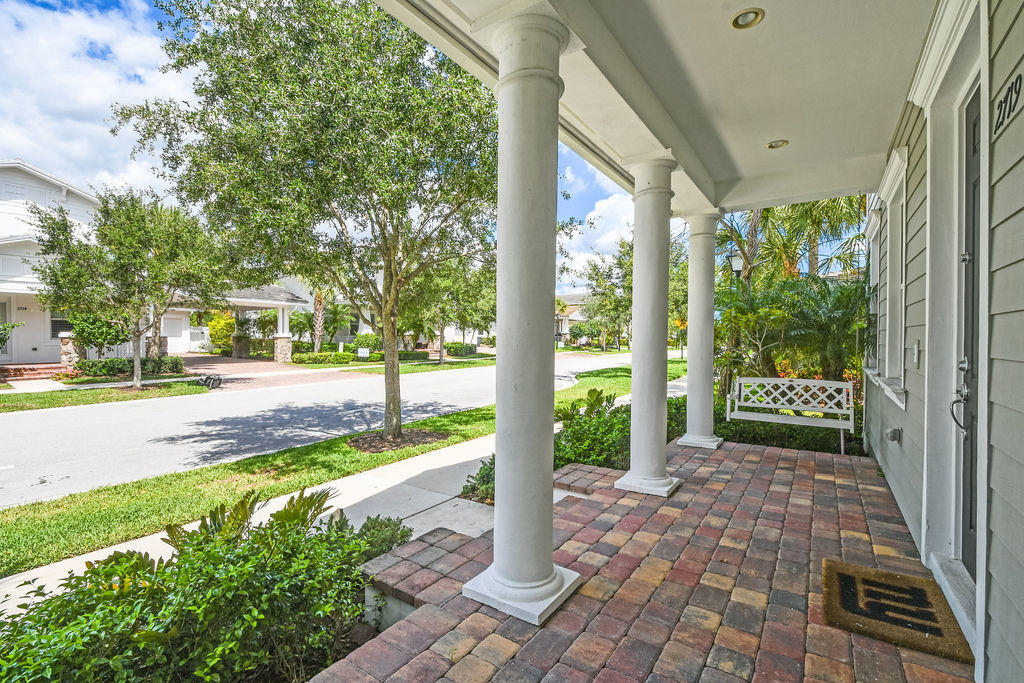 2719 Wymberly Drive Jupiter, FL 33458 - Photo 3 of 49 a view of a garden with pathway