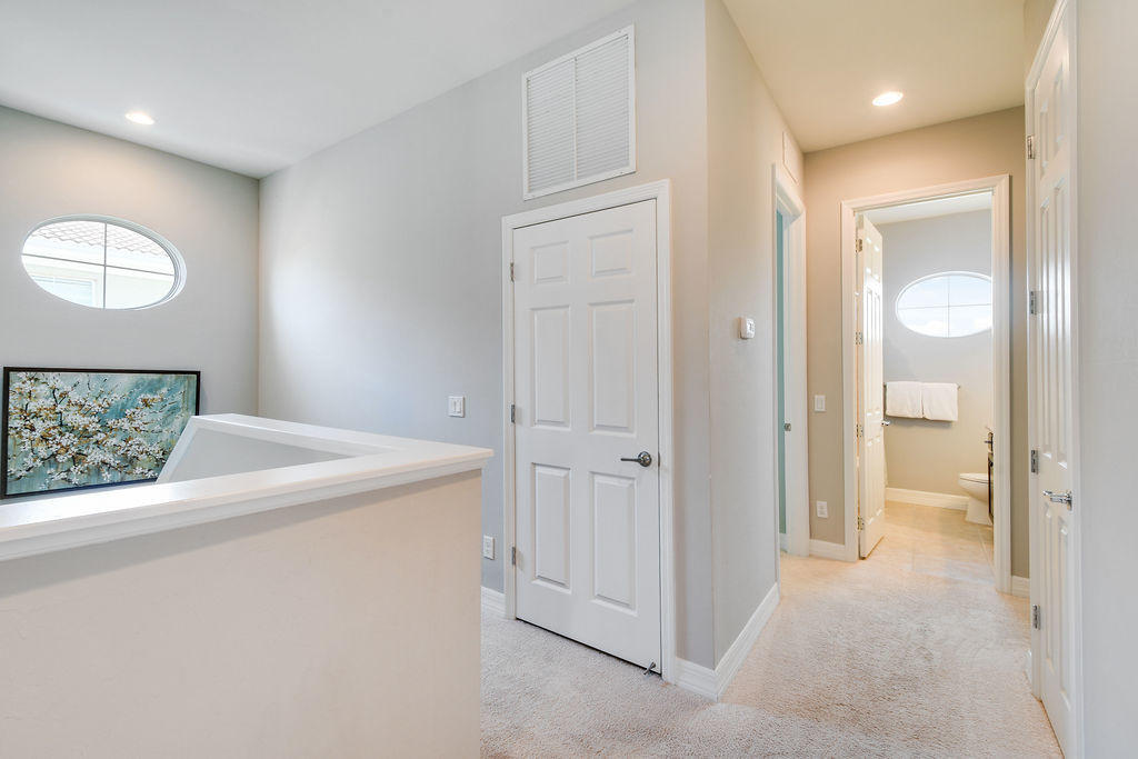 2719 Wymberly Drive Jupiter, FL 33458 - Photo 21 of 49 a view of a hallway to rooms