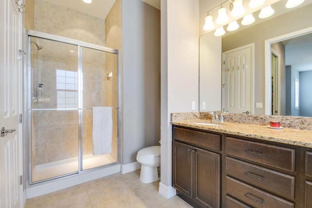 2719 Wymberly Drive Jupiter, FL 33458 - Photo 25 of 49 a bathroom with a double vanity sink toilet and shower