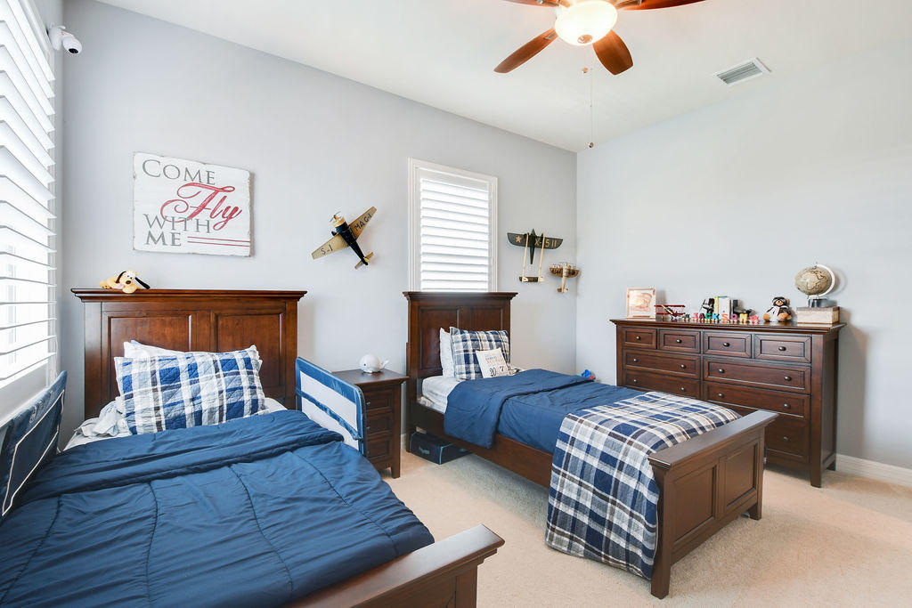 2719 Wymberly Drive Jupiter, FL 33458 - Photo 28 of 49 a living room with furniture and a chandelier