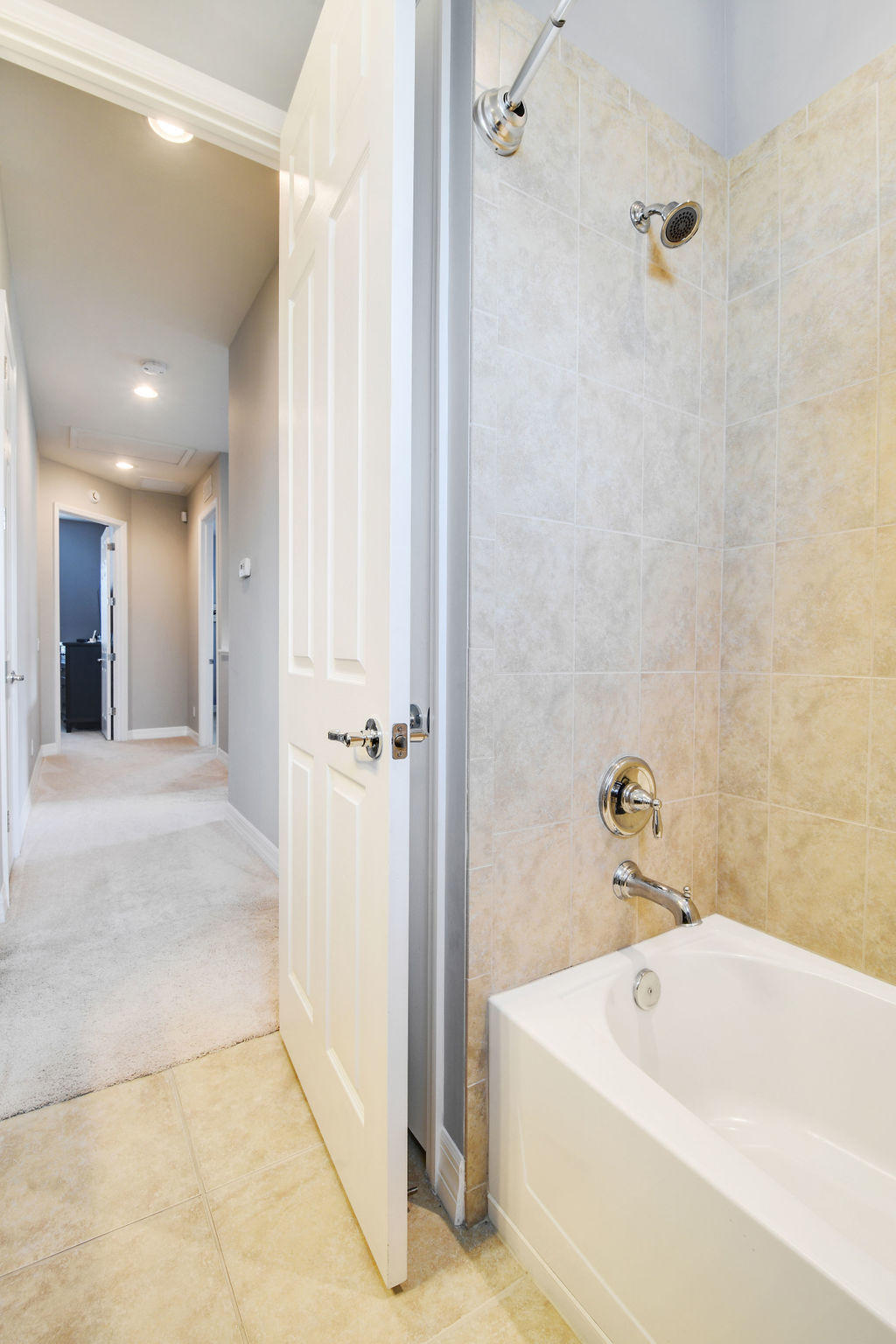 2719 Wymberly Drive Jupiter, FL 33458 - Photo 32 of 49 a bathroom with a tub and shower