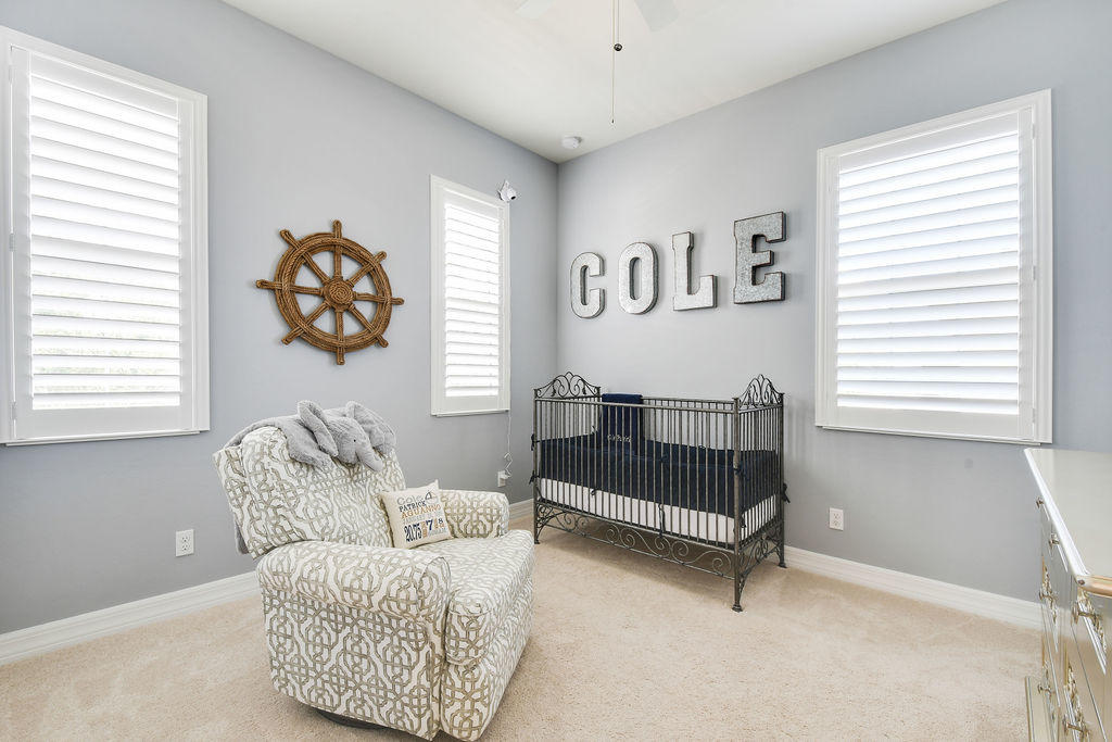 2719 Wymberly Drive Jupiter, FL 33458 - Photo 33 of 49 a bedroom with furniture and a window