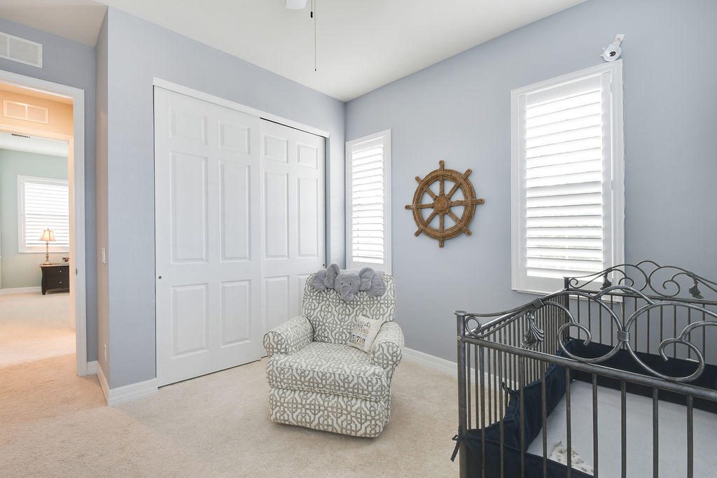 2719 Wymberly Drive Jupiter, FL 33458 - Photo 34 of 49 a living room with furniture and a window