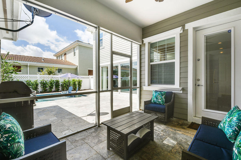 2719 Wymberly Drive Jupiter, FL 33458 - Photo 36 of 49 a balcony with furniture and a potted plant