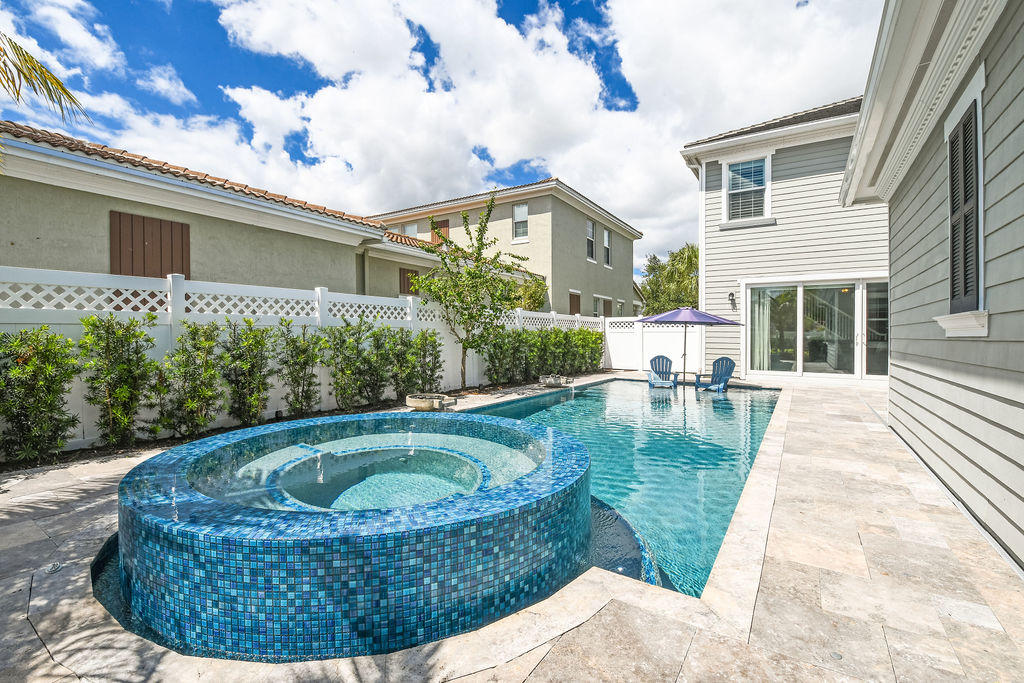 2719 Wymberly Drive Jupiter, FL 33458 - Photo 40 of 49 a view of a house with swimming pool