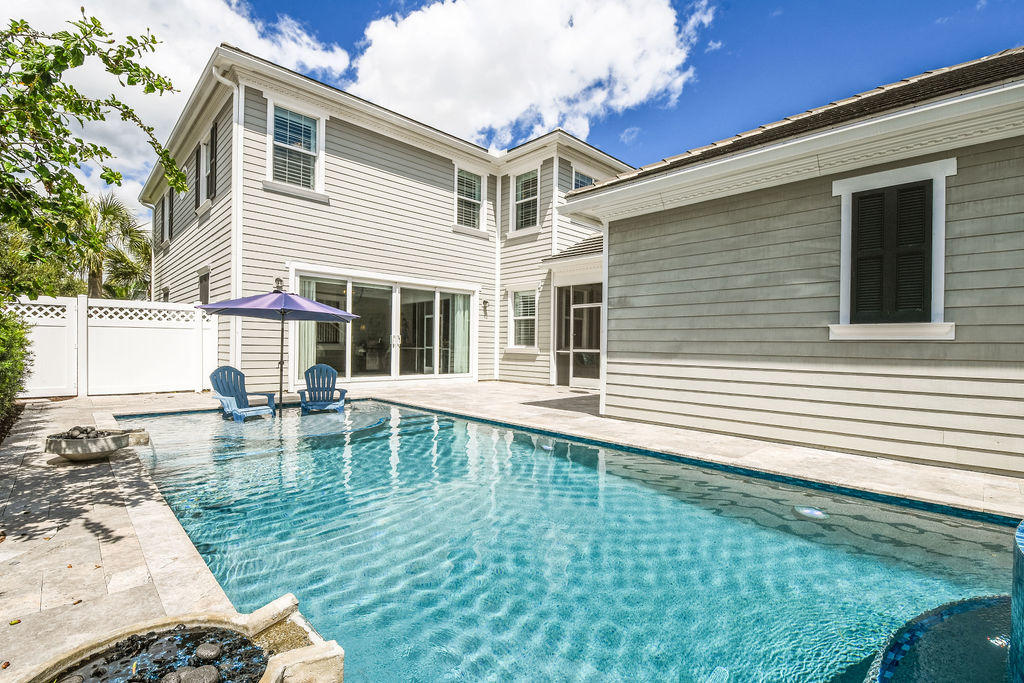 2719 Wymberly Drive Jupiter, FL 33458 - Photo 42 of 49 a front view of a house with swimming pool