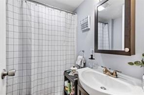 118 Constitution Street Perryopolis, PA 15473 - Photo 28 of 34 a bathroom with a sink a mirror and shower