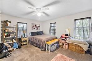 118 Constitution Street Perryopolis, PA 15473 - Photo 29 of 34 a bedroom with a bed and a chandelier