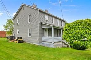 118 Constitution Street Perryopolis, PA 15473 - Photo 3 of 34 a front view of a house with a garden